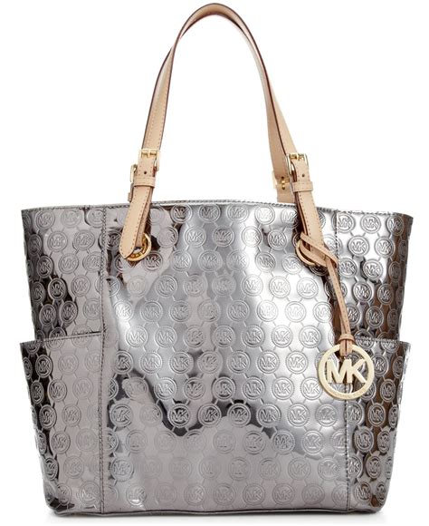 michael kors metallic monogram tote|Michael Kors brown tote bag.